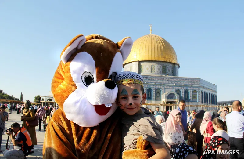 Palestinian Muslim after perform the morning Eid al-Fitr prayer near the Dome of Rock at the Al-Aqsa Mosque compound, Islam's third most holy site, in the old city of Jerusalem on July 6, 2016. Muslims worldwide celebrat...