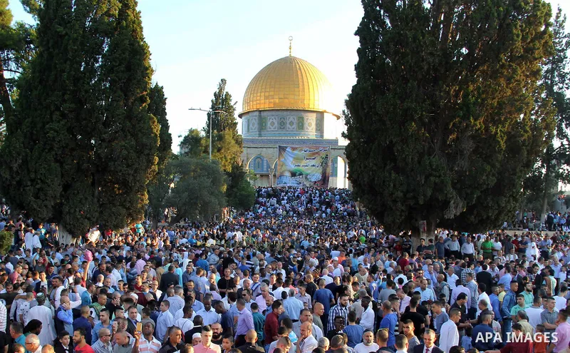 Palestinian Muslim after perform the morning Eid al-Fitr prayer near the Dome of Rock at the Al-Aqsa Mosque compound, Islam's third most holy site, in the old city of Jerusalem on July 6, 2016. Muslims worldwide celebrat...