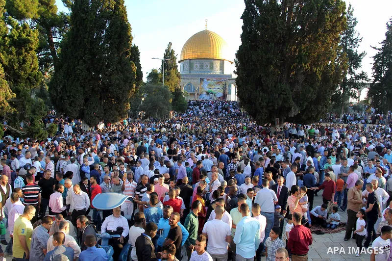 Palestinian Muslim after perform the morning Eid al-Fitr prayer near the Dome of Rock at the Al-Aqsa Mosque compound, Islam's third most holy site, in the old city of Jerusalem on July 6, 2016. Muslims worldwide celebrat...