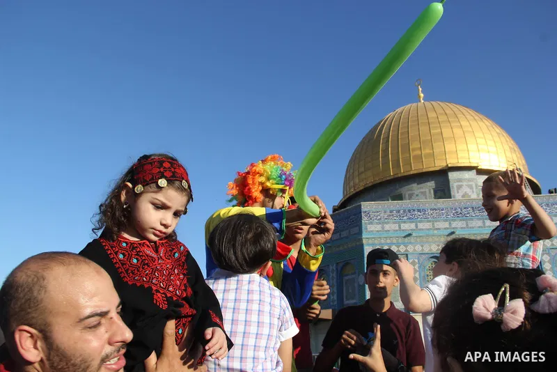 Palestinian Muslim after perform the morning Eid al-Fitr prayer near the Dome of Rock at the Al-Aqsa Mosque compound, Islam's third most holy site, in the old city of Jerusalem on July 6, 2016. Muslims worldwide celebrat...
