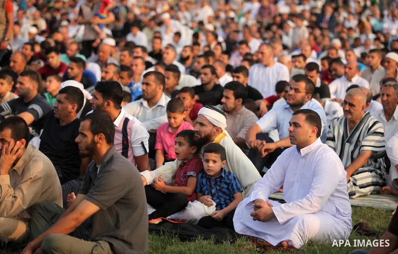 Palestinians attend the morning prayers for Eid al-Fitr celebrations, which marks the end of the holy fasting month of Ramadan, in Gaza City July 6, 2016. Photo by Ashraf Amra