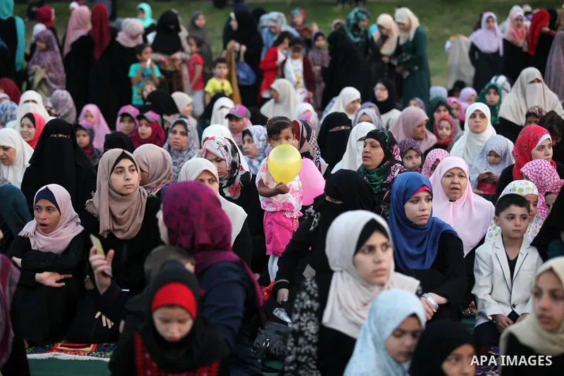 Palestinians attend the morning prayers for Eid al-Fitr celebrations, which marks the end of the holy fasting month of Ramadan, in Gaza City July 6, 2016. Photo by Ashraf Amra