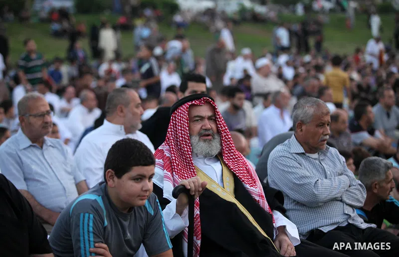 Palestinians attend the morning prayers for Eid al-Fitr celebrations, which marks the end of the holy fasting month of Ramadan, in Gaza City July 6, 2016. Photo by Ashraf Amra