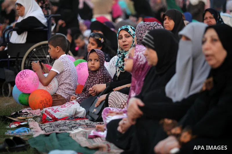 Palestinians attend the morning prayers for Eid al-Fitr celebrations, which marks the end of the holy fasting month of Ramadan, in Gaza City July 6, 2016. Photo by Ashraf Amra