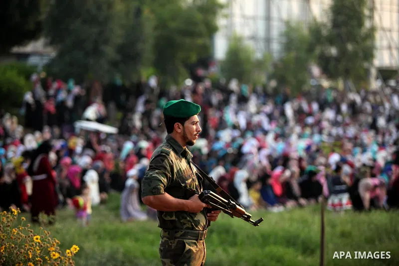 A member of Palestinian security forces loyal to Hamas stands guard during the morning prayers for Eid al-Fitr celebrations, which marks the end of the holy fasting month of Ramadan, in Gaza City July 6, 2016. Photo by A...