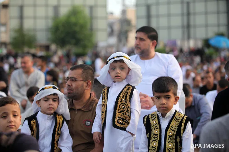 Palestinians attend the morning prayers for Eid al-Fitr celebrations, which marks the end of the holy fasting month of Ramadan, in Gaza City July 6, 2016. Photo by Ashraf Amra