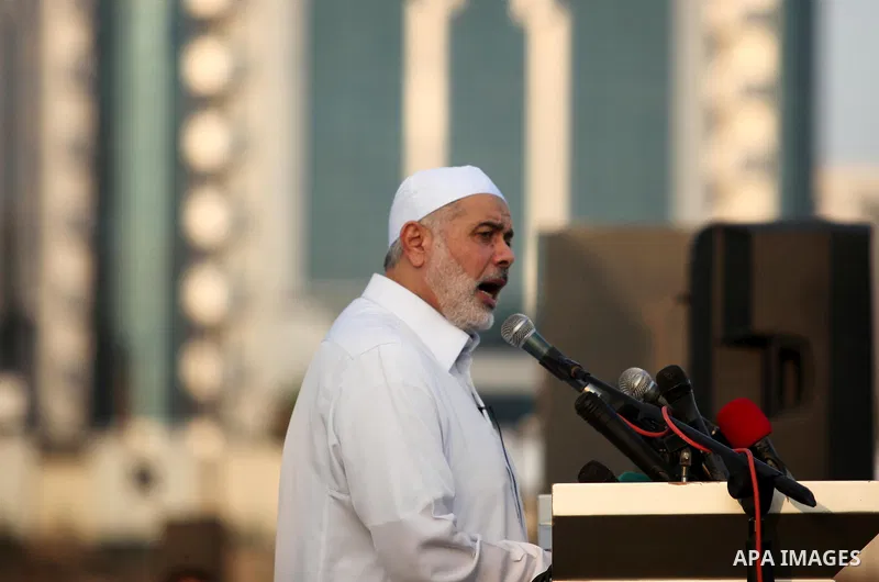 Senior Hamas leader Ismail Haniyeh leads the morning prayers for Eid al-Fitr celebrations, which marks the end of the holy fasting month of Ramadan, in Gaza City July 6, 2016. Photo by Ashraf Amra