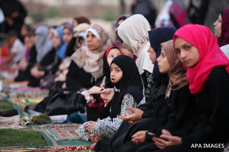 Palestinians attend the morning prayers for Eid al-Fitr celebrations, which marks the end of the holy fasting month of Ramadan, in Gaza City July 6, 2016. Photo by Ashraf Amra