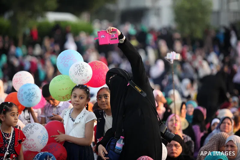 Palestinians attend the morning prayers for Eid al-Fitr celebrations, which marks the end of the holy fasting month of Ramadan, in Gaza City July 6, 2016. Photo by Ashraf Amra