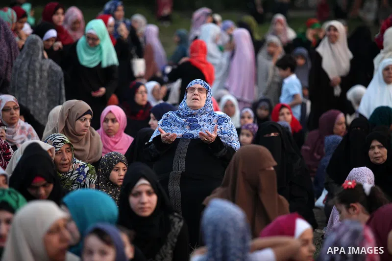 Palestinians attend the morning prayers for Eid al-Fitr celebrations, which marks the end of the holy fasting month of Ramadan, in Gaza City July 6, 2016. Photo by Ashraf Amra