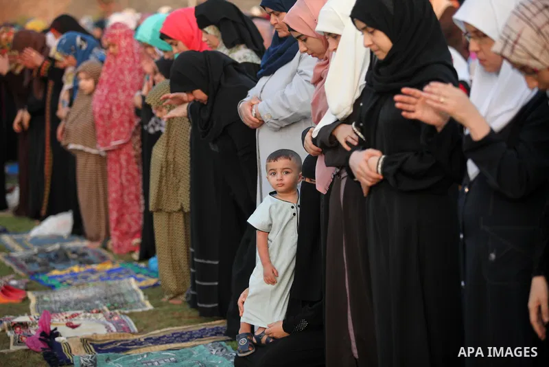Palestinians attend the morning prayers for Eid al-Fitr celebrations, which marks the end of the holy fasting month of Ramadan, in Gaza City July 6, 2016. Photo by Ashraf Amra