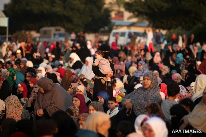 Palestinians attend the morning prayers for Eid al-Fitr celebrations, which marks the end of the holy fasting month of Ramadan, in Gaza City July 6, 2016. Photo by Ashraf Amra