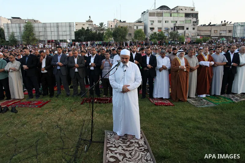 Senior Hamas leader Ismail Haniyeh leads the morning prayers for Eid al-Fitr celebrations, which marks the end of the holy fasting month of Ramadan, in Gaza City July 6, 2016. Photo by Ashraf Amra