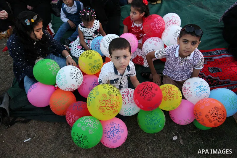 Palestinians attend the morning prayers for Eid al-Fitr celebrations, which marks the end of the holy fasting month of Ramadan, in Gaza City July 6, 2016. Photo by Ashraf Amra