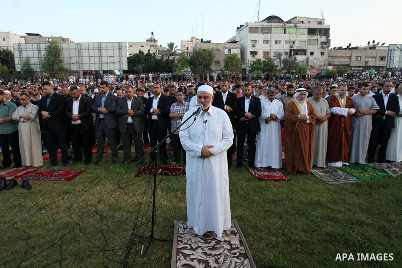 Senior Hamas leader Ismail Haniyeh leads the morning prayers for Eid al-Fitr celebrations, which marks the end of the holy fasting month of Ramadan, in Gaza City July 6, 2016. Photo by Ashraf Amra