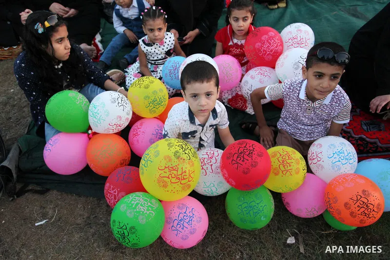 Palestinians attend the morning prayers for Eid al-Fitr celebrations, which marks the end of the holy fasting month of Ramadan, in Gaza City July 6, 2016. Photo by Ashraf Amra