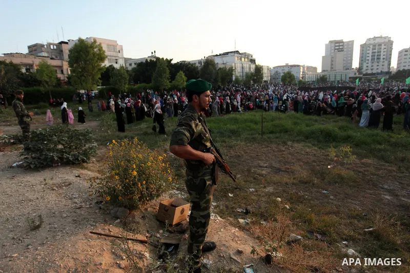 A member of Palestinian security forces loyal to Hamas stands guard during the morning prayers for Eid al-Fitr celebrations, which marks the end of the holy fasting month of Ramadan, in Gaza City July 6, 2016. Photo by A...