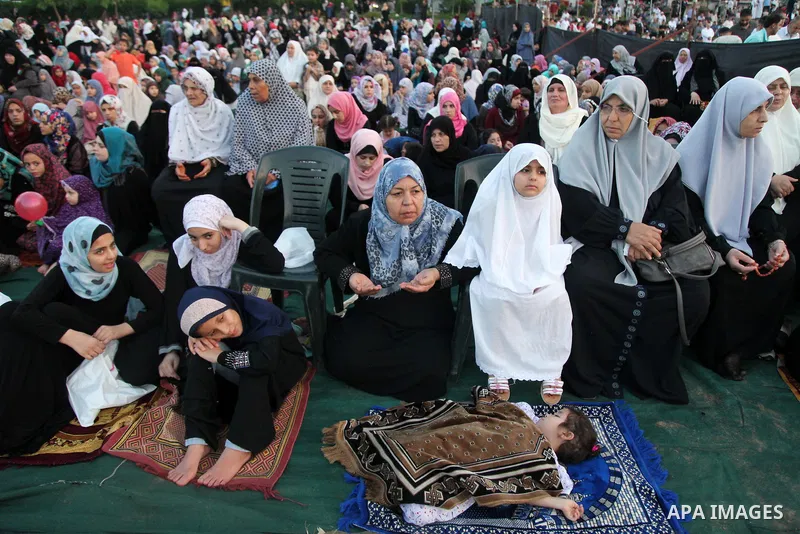 Palestinians attend the morning prayers for Eid al-Fitr celebrations, which marks the end of the holy fasting month of Ramadan, in Gaza City July 6, 2016. Photo by Ashraf Amra