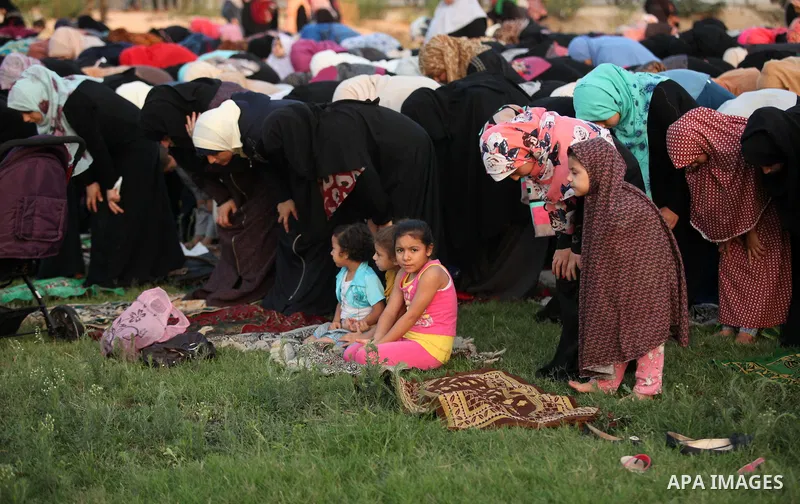 Palestinians attend the morning prayers for Eid al-Fitr celebrations, which marks the end of the holy fasting month of Ramadan, in Gaza City July 6, 2016. Photo by Ashraf Amra