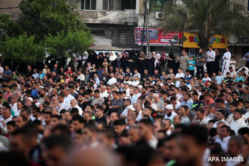 Palestinians attend the morning prayers for Eid al-Fitr celebrations, which marks the end of the holy fasting month of Ramadan, in Gaza City July 6, 2016. Photo by Ashraf Amra