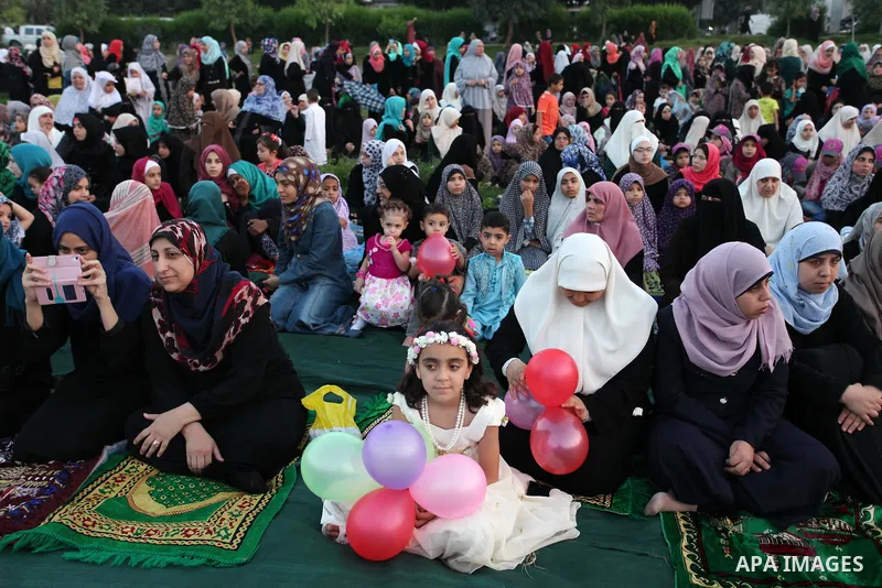 Palestinians attend the morning prayers for Eid al-Fitr celebrations, which marks the end of the holy fasting month of Ramadan, in Gaza City July 6, 2016. Photo by Ashraf Amra
