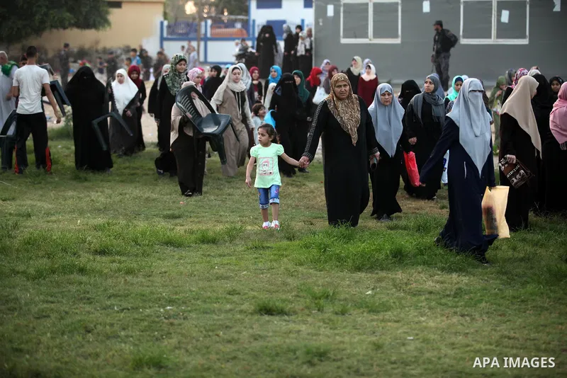 Palestinians attend the morning prayers for Eid al-Fitr celebrations, which marks the end of the holy fasting month of Ramadan, in Gaza City July 6, 2016. Photo by Ashraf Amra