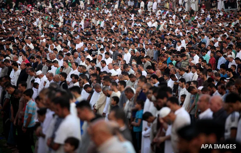 Palestinians attend the morning prayers for Eid al-Fitr celebrations, which marks the end of the holy fasting month of Ramadan, in Gaza City July 6, 2016. Photo by Ashraf Amra