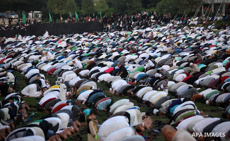 Palestinians attend the morning prayers for Eid al-Fitr celebrations, which marks the end of the holy fasting month of Ramadan, in Gaza City July 6, 2016. Photo by Ashraf Amra