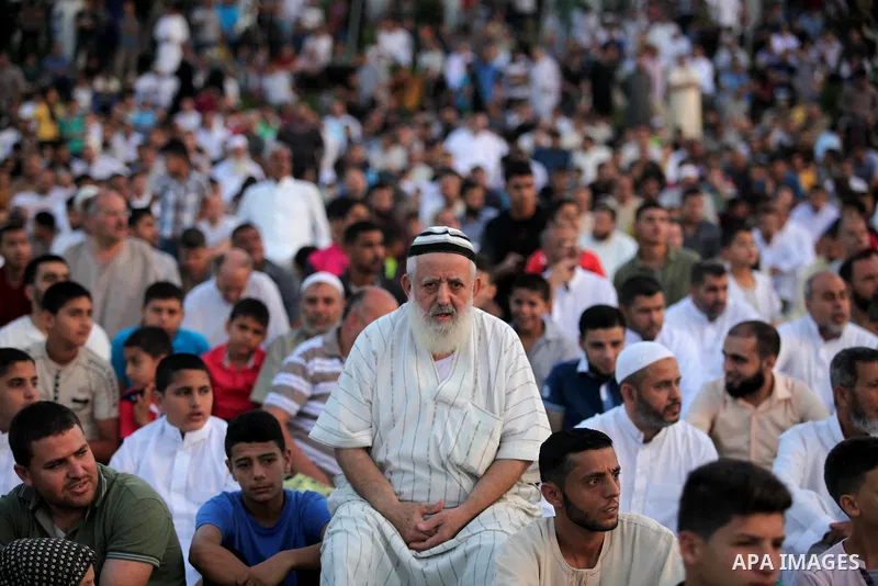 Palestinians attend the morning prayers for Eid al-Fitr celebrations, which marks the end of the holy fasting month of Ramadan, in Gaza City July 6, 2016. Photo by Ashraf Amra