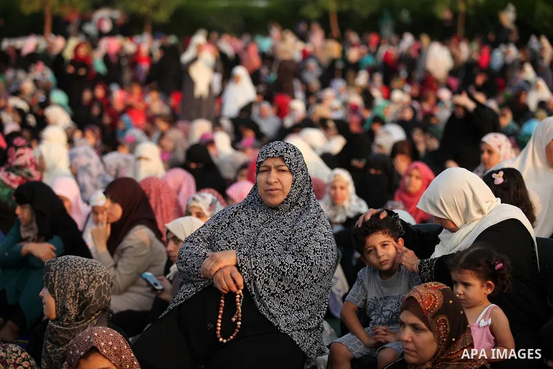 Palestinians attend the morning prayers for Eid al-Fitr celebrations, which marks the end of the holy fasting month of Ramadan, in Gaza City July 6, 2016. Photo by Ashraf Amra