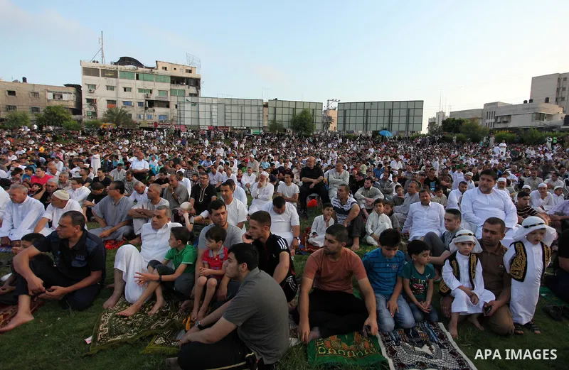 Palestinians attend the morning prayers for Eid al-Fitr celebrations, which marks the end of the holy fasting month of Ramadan, in Gaza City July 6, 2016. Photo by Ashraf Amra