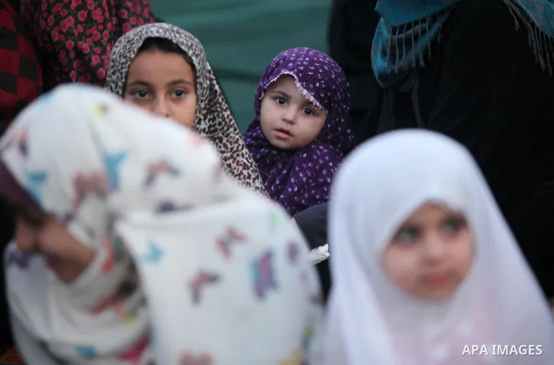 Palestinians attend the morning prayers for Eid al-Fitr celebrations, which marks the end of the holy fasting month of Ramadan, in Gaza City July 6, 2016. Photo by Ashraf Amra