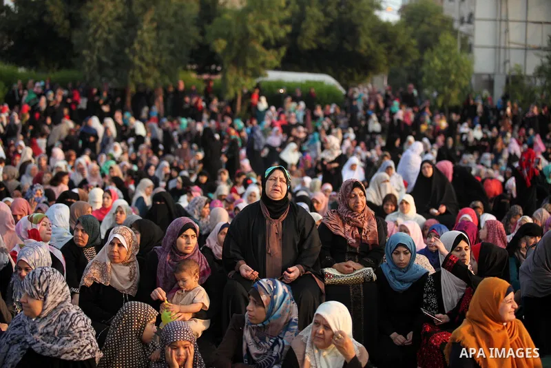 Palestinians attend the morning prayers for Eid al-Fitr celebrations, which marks the end of the holy fasting month of Ramadan, in Gaza City July 6, 2016. Photo by Ashraf Amra