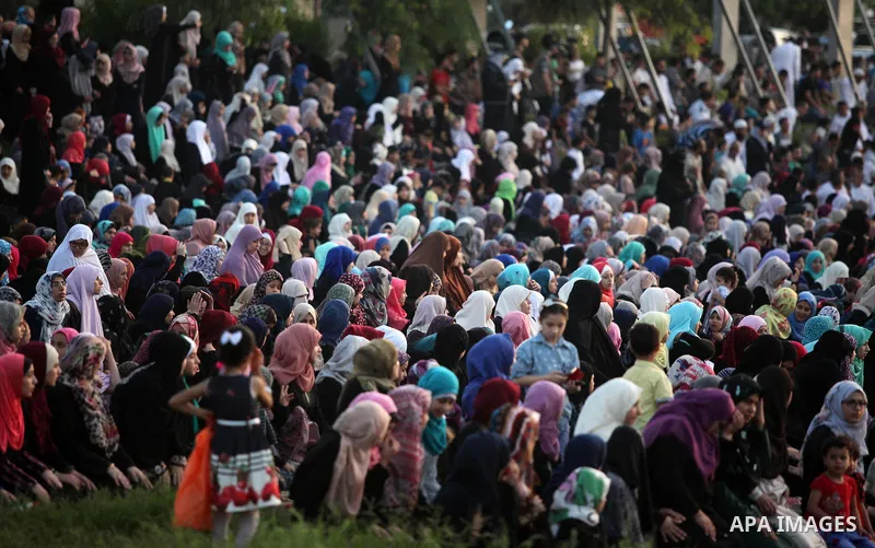 Palestinians attend the morning prayers for Eid al-Fitr celebrations, which marks the end of the holy fasting month of Ramadan, in Gaza City July 6, 2016. Photo by Ashraf Amra