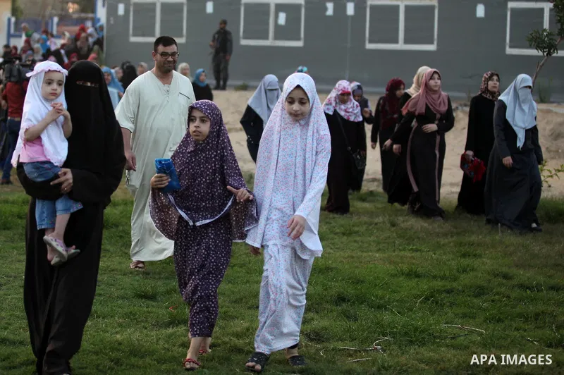 Palestinians attend the morning prayers for Eid al-Fitr celebrations, which marks the end of the holy fasting month of Ramadan, in Gaza City July 6, 2016. Photo by Ashraf Amra