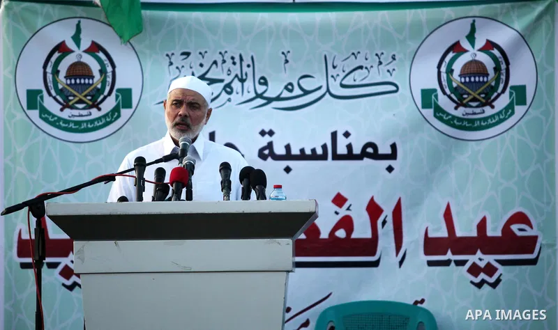 Senior Hamas leader Ismail Haniyeh leads the morning prayers for Eid al-Fitr celebrations, which marks the end of the holy fasting month of Ramadan, in Gaza City July 6, 2016. Photo by Ashraf Amra