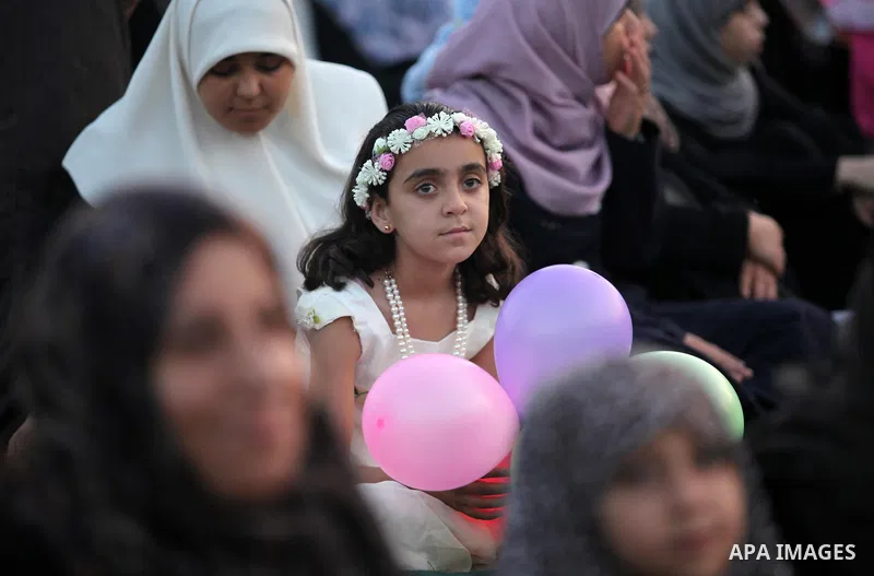 Palestinians attend the morning prayers for Eid al-Fitr celebrations, which marks the end of the holy fasting month of Ramadan, in Gaza City July 6, 2016. Photo by Ashraf Amra