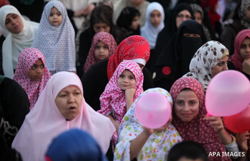 Palestinians attend the morning prayers for Eid al-Fitr celebrations, which marks the end of the holy fasting month of Ramadan, in Gaza City July 6, 2016. Photo by Ashraf Amra