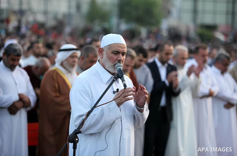 Senior Hamas leader Ismail Haniyeh leads the morning prayers for Eid al-Fitr celebrations, which marks the end of the holy fasting month of Ramadan, in Gaza City July 6, 2016. Photo by Ashraf Amra