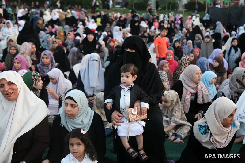 Palestinians attend the morning prayers for Eid al-Fitr celebrations, which marks the end of the holy fasting month of Ramadan, in Gaza City July 6, 2016. Photo by Ashraf Amra