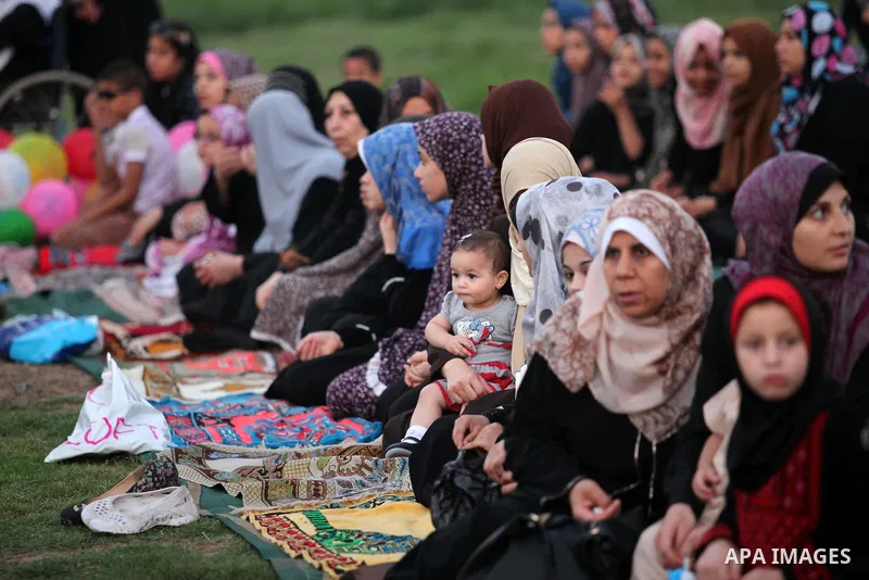 Palestinians attend the morning prayers for Eid al-Fitr celebrations, which marks the end of the holy fasting month of Ramadan, in Gaza City July 6, 2016. Photo by Ashraf Amra