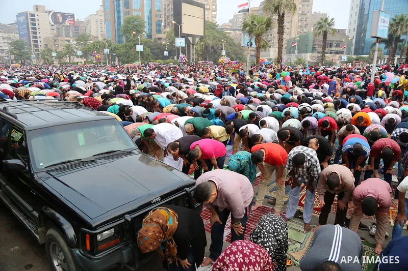 Egyptian Muslims attend the morning prayers for Eid al-Fitr celebrations, which marks the end of the holy fasting month of Ramadan, at Mustafa Mahmoud Squar, in Cairo, Egypt, on July 06, 2016. Photo by Amr Sayed