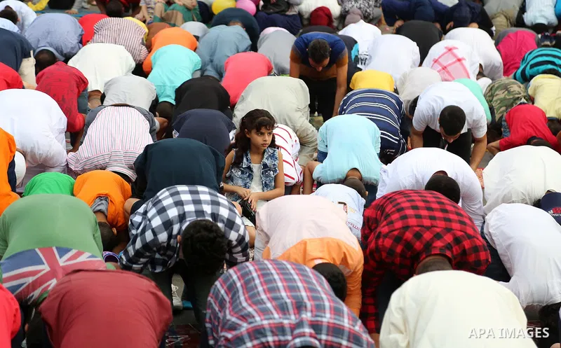 Egyptian Muslims attend the morning prayers for Eid al-Fitr celebrations, which marks the end of the holy fasting month of Ramadan, at Mustafa Mahmoud Squar, in Cairo, Egypt, on July 06, 2016. Photo by Amr Sayed