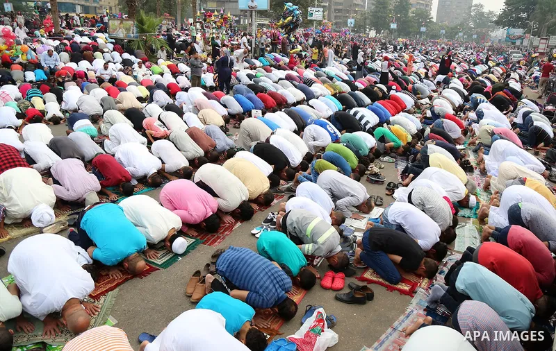 Egyptian Muslims attend the morning prayers for Eid al-Fitr celebrations, which marks the end of the holy fasting month of Ramadan, at Mustafa Mahmoud Squar, in Cairo, Egypt, on July 06, 2016. Photo by Amr Sayed