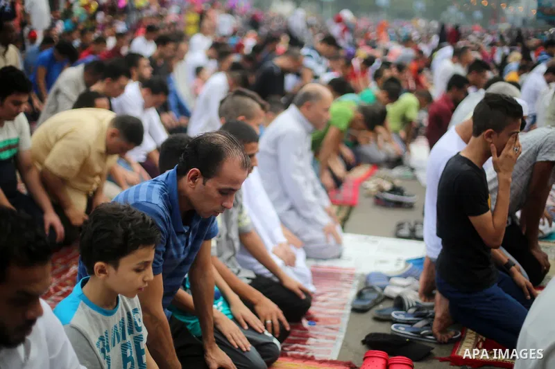 Egyptian Muslims attend the morning prayers for Eid al-Fitr celebrations, which marks the end of the holy fasting month of Ramadan, at Mustafa Mahmoud Squar, in Cairo, Egypt, on July 06, 2016. Photo by Amr Sayed