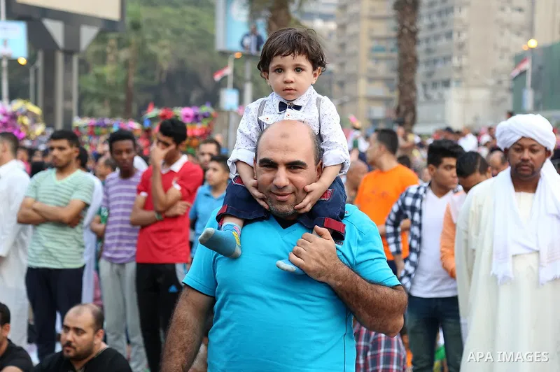 Egyptian Muslims attend the morning prayers for Eid al-Fitr celebrations, which marks the end of the holy fasting month of Ramadan, at Mustafa Mahmoud Squar, in Cairo, Egypt, on July 06, 2016. Photo by Amr Sayed