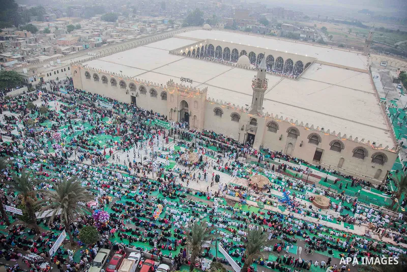 Egyptian Muslims attend the morning prayers for Eid al-Fitr celebrations, which marks the end of the holy fasting month of Ramadan, outside Amr Ibn El-Aas mosque, in Cairo, Egypt, on July 06, 2016. Photo by Amr Sayed