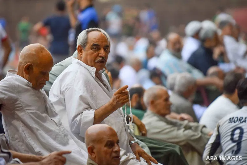 Egyptian Muslims attend the morning prayers for Eid al-Fitr celebrations, which marks the end of the holy fasting month of Ramadan, outside Amr Ibn El-Aas mosque, in Cairo, Egypt, on July 06, 2016. Photo by Amr Sayed
