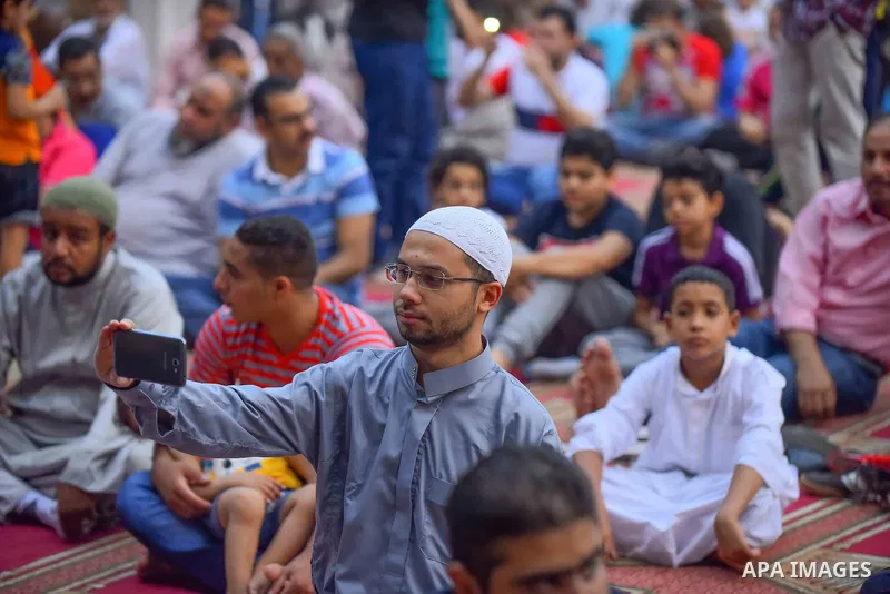 Egyptian Muslims attend the morning prayers for Eid al-Fitr celebrations, which marks the end of the holy fasting month of Ramadan, outside Amr Ibn El-Aas mosque, in Cairo, Egypt, on July 06, 2016. Photo by Amr Sayed