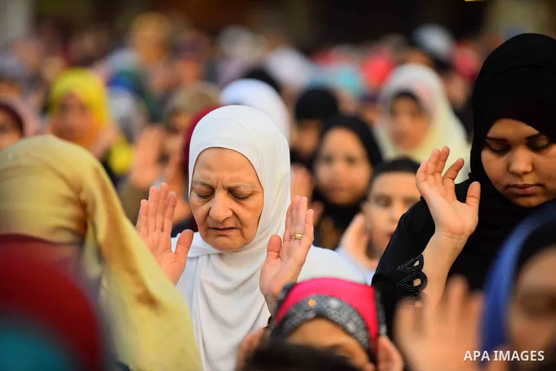 Egyptian Muslims attend the morning prayers for Eid al-Fitr celebrations, which marks the end of the holy fasting month of Ramadan, outside Amr Ibn El-Aas mosque, in Cairo, Egypt, on July 06, 2016. Photo by Amr Sayed